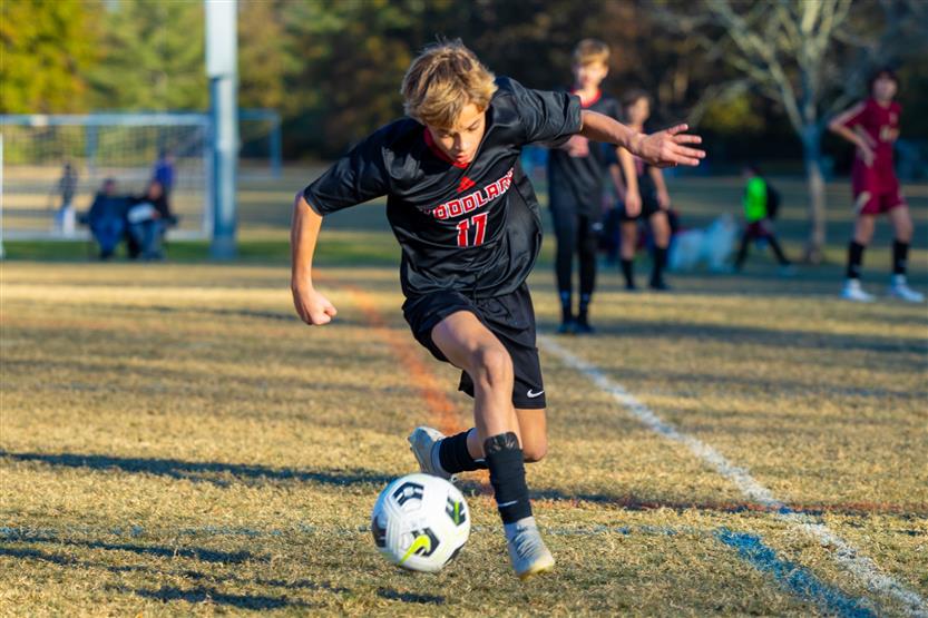 Middle school students play soccer